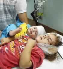 At Least 12 Killed, Scores Wounded in Israeli Raids